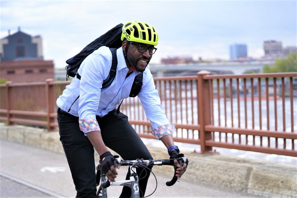 Biking across the Stone Arch Bridge in Minneapolis