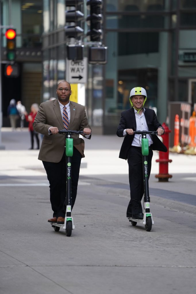 Men on scooters