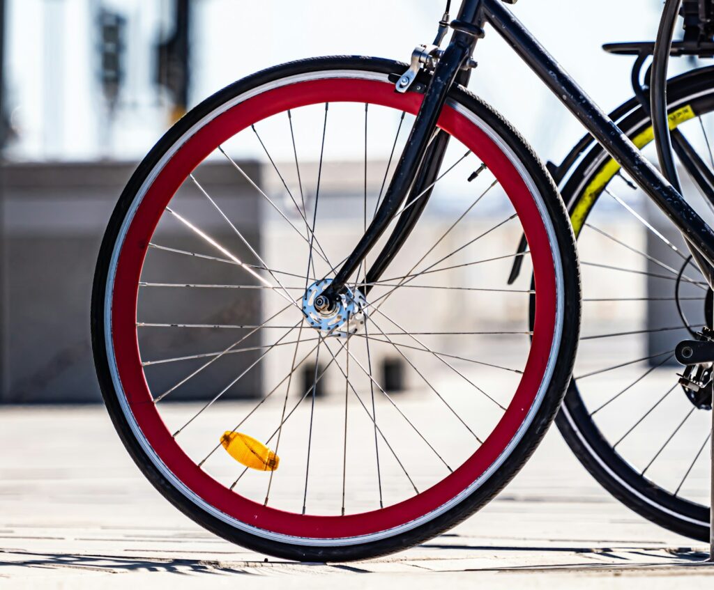A close up of a bike parked on a sidewalk